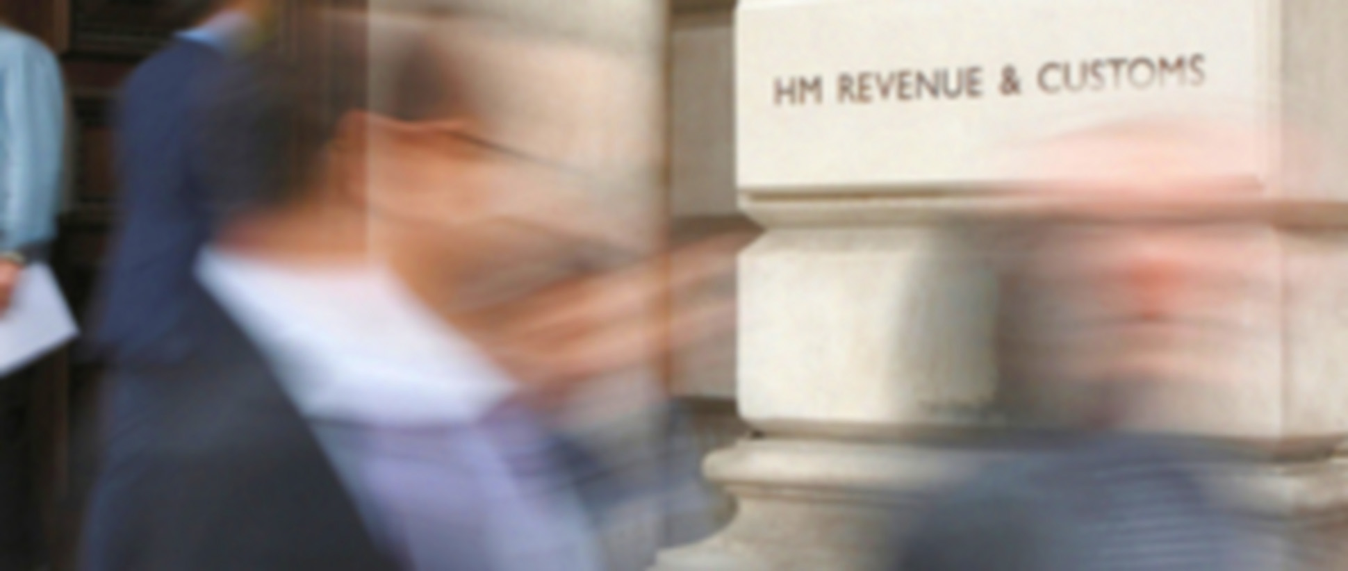 HMRC building with blurry passerby's