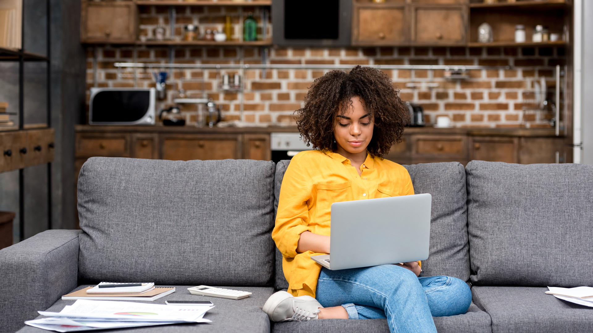 Property manager using Mojo on her laptop at home, Mojo is specifically designed for remote working