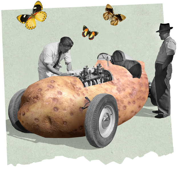 vintage car made from a potato, with two men working on it