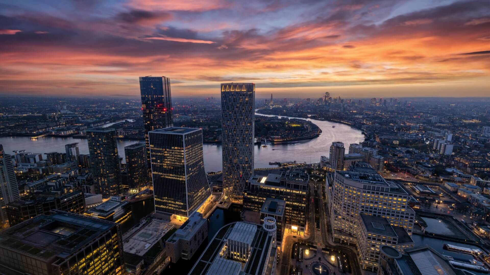 Image of the city skyline at nighttime, where managing agents use software